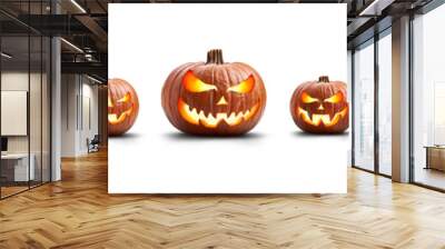 A group of eight lit spooky halloween pumpkins, Jack O Lantern with evil face and eyes isolated against a white background. Wall mural