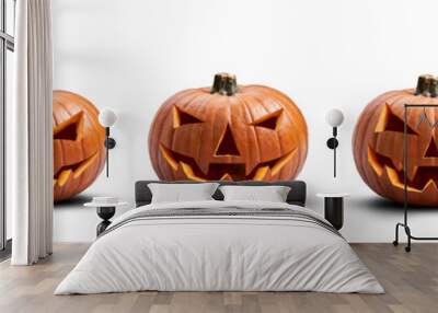 A group of five unlit spooky halloween pumpkins, Jack O Lantern with evil face and eyes isolated against a white background. Wall mural