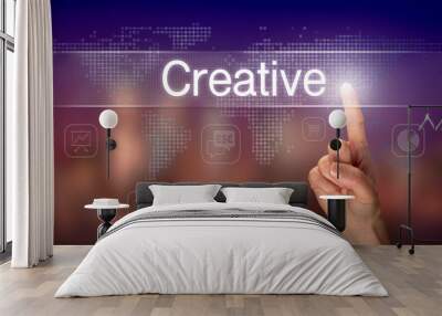 A hand selecting a Creative business concept on a clear screen with a colorful blurred background. Wall mural