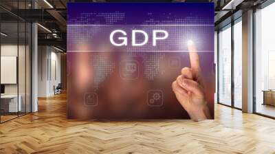 a hand selecting a gdp business concept on a clear screen with a colorful blurred background. Wall mural