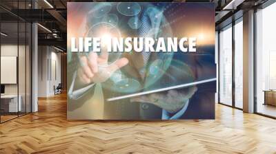 A hand selecting a Life Insurance business concept on a futuristic computer display. Wall mural