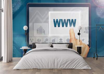 A hand selecting a WWW business concept on a computer tablet screen with a colorful background. Wall mural