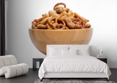 A snack bowl of salted savoury party food, crispy nibbles isolated against a transparent background viewed from the side. Wall mural