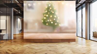 A wood table, tabletop product display with a festive Christmas background of Christmas tree and fairy lights. Wall mural