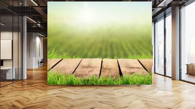 A wooden table with a sunny summers farmland background Wall mural