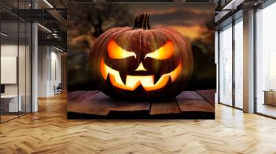 one spooky halloween pumpkin, jack o lantern, with an evil face and eyes on a wooden bench, table wi Wall mural