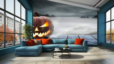 One spooky halloween pumpkin, Jack O Lantern, with an evil face and eyes on a wooden bench, table with a misty gray coastal night background with space for product placement. Wall mural