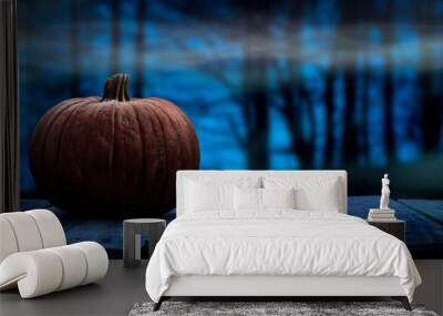 One spooky halloween pumpkin blank template on a wooden bench with a misty forest night background with space for product placement. Wall mural