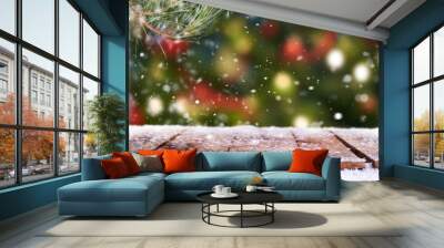 Traditional festive Christmas tree light decoration background with a snow covered wooden table top. Wall mural