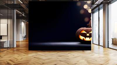 Two halloween lanterns with evil eyes and face on a wood table with a spooky dark blue background at night. Wall mural