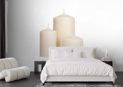 White candle on a dark wooden floor. Wall mural