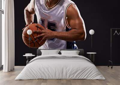 Got game. Studio shot of a basketball player against a black background. Wall mural