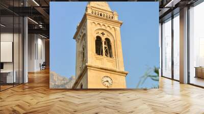 Church in background with olive leaves Wall mural