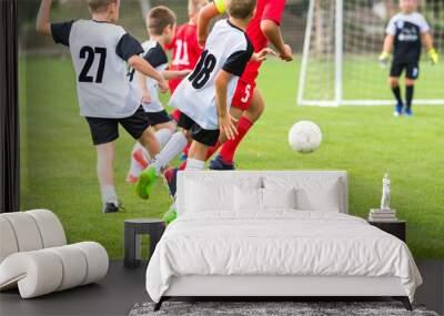 Boys play soccer sports field Wall mural