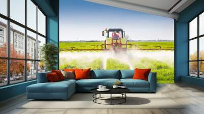 Tractor spraying wheat field Wall mural