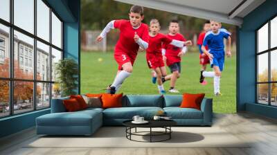 Young children players football match on soccer field Wall mural