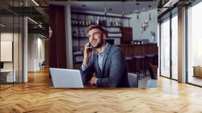 A businessman talking on the phone in a cafe Wall mural