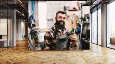 An industry worker checking on bus construction in vehicle production factory. Wall mural