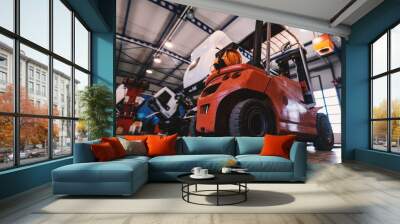 Picture of forklift in car repairing workshop. Wall mural