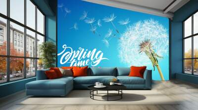 Beautiful vector dandelion with flying seeds on cloudy sky Wall mural