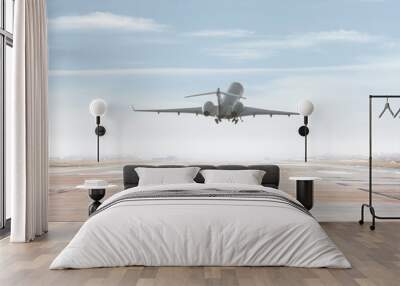 Modern corporate business jet take off from airport runway Wall mural