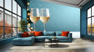 Cheers to festive season with two wine glasses, snowflakes falling gently. Wall mural