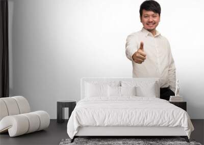 Asian businessman wear white shirt show thumps up by one hand, smiling and feeling happy, look at camera, isolate on white background Wall mural