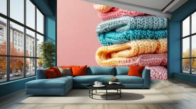 A stack of colorful knitted sweaters Wall mural