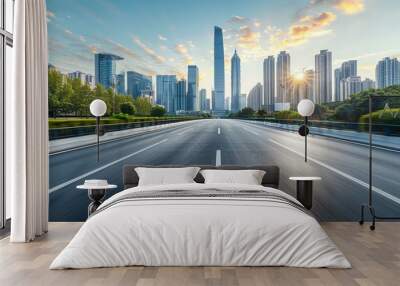 Empty asphalt road through a modern city at sunrise Wall mural