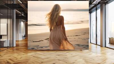 Outdoor fashion portrait of beautiful sensual lady wearing stylish maxi chiffon dress posing at sunset in the beach, have long blonde hairs bright make up and accessorizes Wall mural