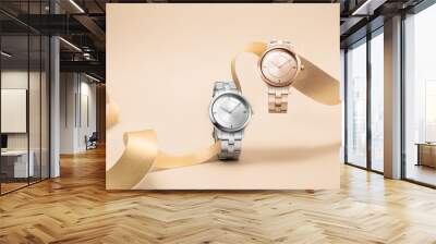 Luxury women watches floating on ribbom on seamless background concept Wall mural