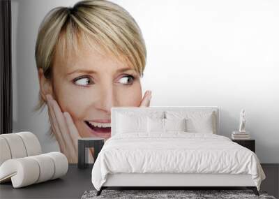 young blond woman surprised expression close up shoot Wall mural