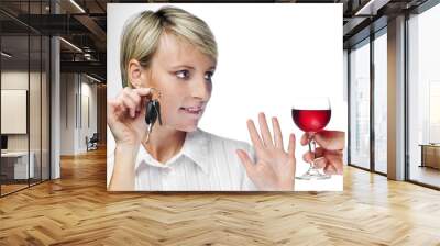 young blond woman with car keys declining drink close up Wall mural