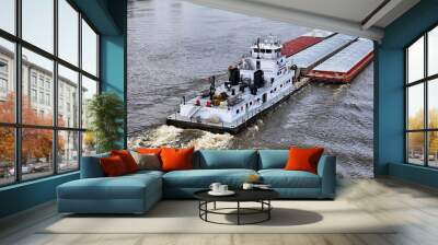 Close up of a Tug boat pushing a large set of barges up the Mississippi River Wall mural