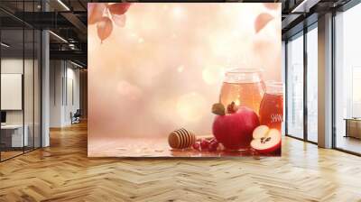 Honey jars with pomegranate and apples on table, concept of Rosh Hashanah, background Wall mural