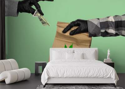 courier's hand in latex gloves holds a paper  bag with marijuana leaf  and female hand in latex gloves gives him Wall mural