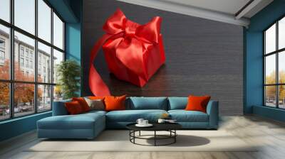 red gift box with red satin ribbon top view Wall mural