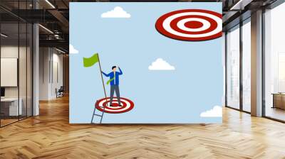 Challenge higher target, businessman climbing ladder, reaching goal and looking for next higher rung. Wall mural