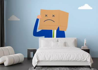 Unsatisfied customer, Unhappy man in a cardboard box with a sad expression, feeling frustrated. Wall mural