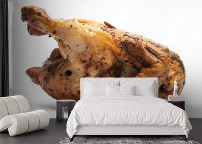 A whole delicious roasted chicken seasoned with herbs isolated on white background clipping path Wall mural