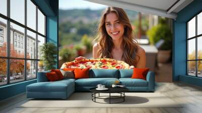 A pretty happy young girl holding a pizza Wall mural