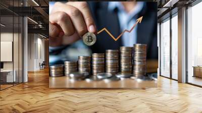 Businessman holding coins and making a growth graph with a business concept on a table, in a financial stock market money view. Wall mural