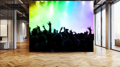 cheering crowd in front of colorful stage lights Wall mural