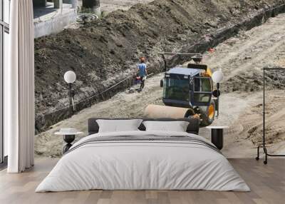 vibratory soil compactors at a construction site preparing the soil Wall mural