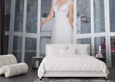 bride in a beautiful wedding dress in the studio Wall mural