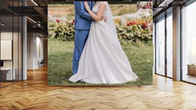 groom with bride together autumn park at wedding Wall mural