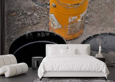 Two metal buckets of paint or tar buckets at a construction site Wall mural