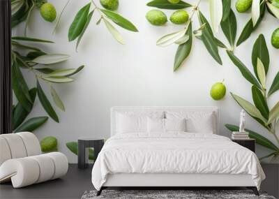 Frame or borders made of fresh green olive fruit with leaves on white background Wall mural