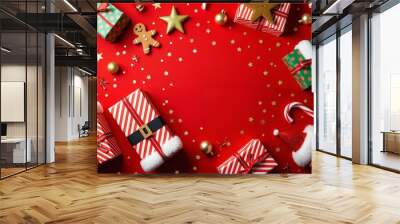 christmas gifts on red background with copy space Wall mural