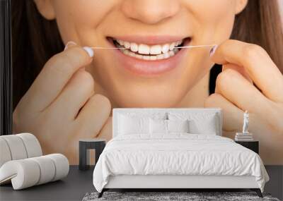 dental floss with a smile and beautiful teeth. flossing Wall mural